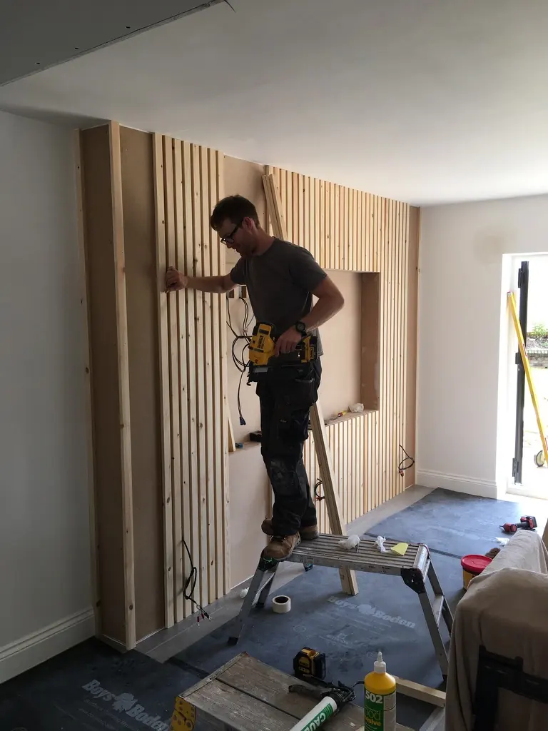 Slats being fitted - Media Wall - High end media wall