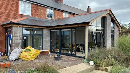 Glazing in cladding underway - Rear extension - New kitchen + living space in Harmer Hill